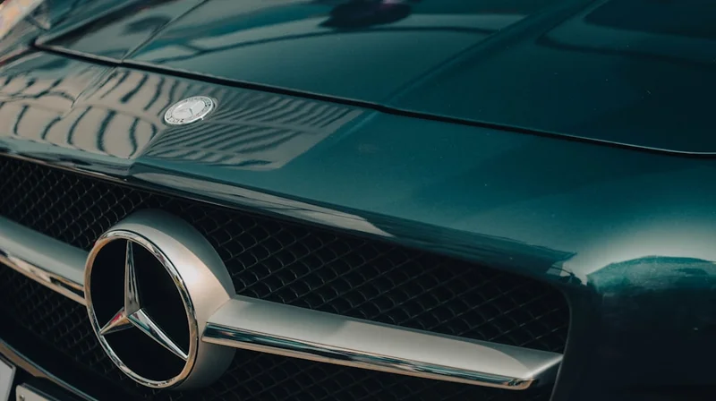Close-up of a dark green mercedes-benz car grille
